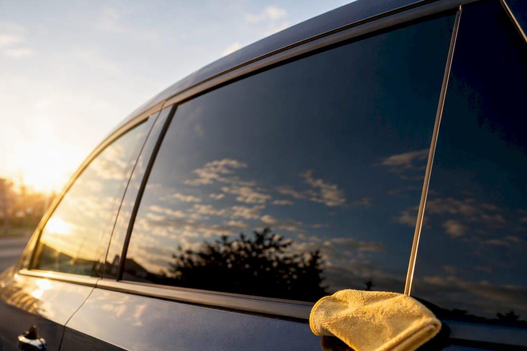 Tinted vehicle window blocking bright sunlight
