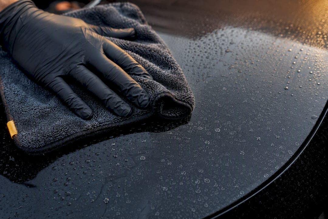 Detailer removing water spots from PPF
