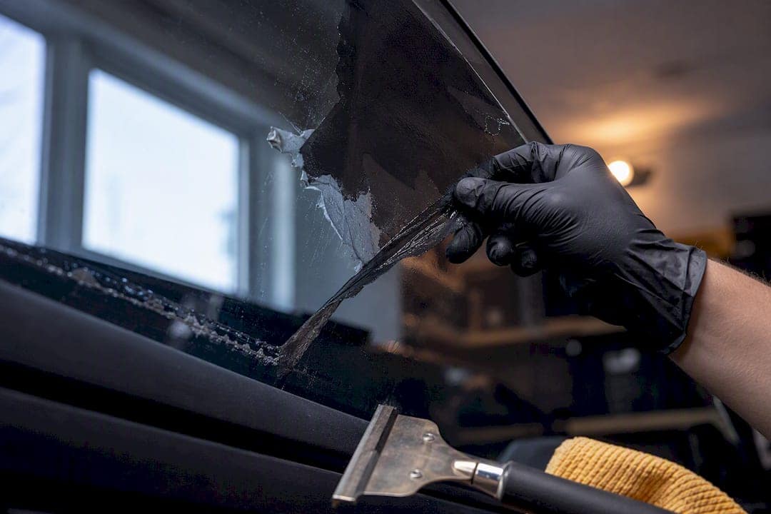 Old tint film lifted from vehicle glass