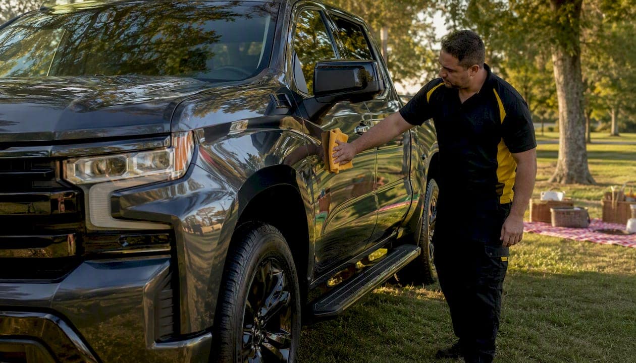 Pickup truck with fresh paint protection film and installer