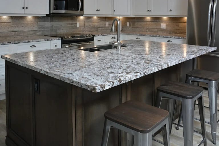 Clear protective film on a stone countertop in a Calgary kitchen