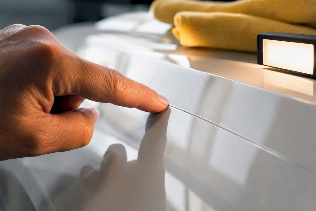Technician checking a sealed PPF edge